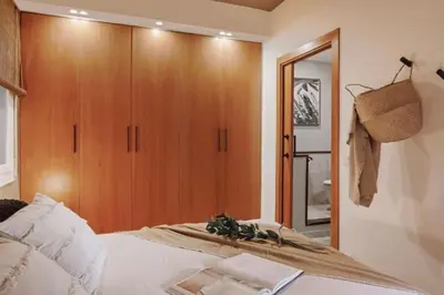 a bedroom with a bed with pillows on it at Babinga - 3 bedroom and balcony in Eixample Esquerra in Barcelona