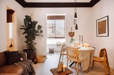 a living room with a table and a couch at Hemba - 3 bedroom and balcony in Gracia in Barcelona