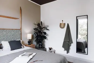 a small bedroom with a bed and a window at Hemba - 3 bedroom and balcony in Gracia in Barcelona
