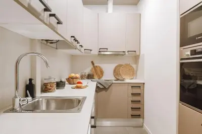 a living room with a couch and a table at Ulindi - 2 bedroom with balcony in Eixample Esquerra in Barcelona