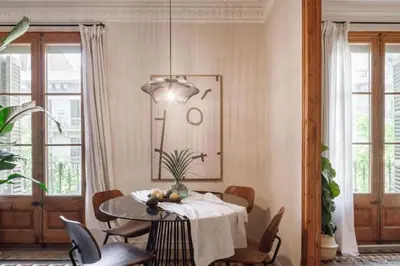 a bedroom with a bed and a window at Ulindi - 2 bedroom with balcony in Eixample Esquerra in Barcelona