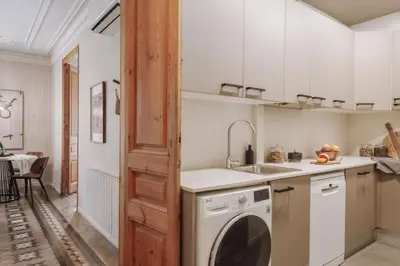 a bathroom with a shower and a toilet and a sink at Ulindi - 2 bedroom with balcony in Eixample Esquerra in Barcelona