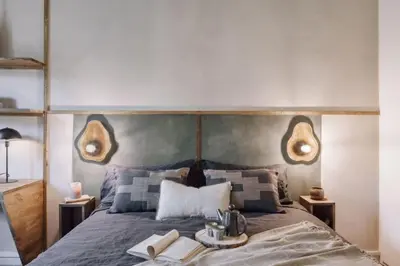 a bedroom with a bed and a desk in it at Ulindi - 2 bedroom with balcony in Eixample Esquerra in Barcelona