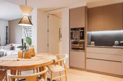 a living room with a couch and a table at Pende - 1 bedroom and swimming pool in Passeig de Gracia in Barcelona