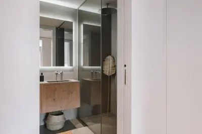 a living room with a table and chairs at Bemba - 1 bedroom and swimming pool in Passeig de Gracia in Barcelona