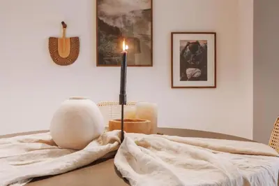 a living room with a white couch and a table at Kele - 1 bedroom and swimming pool in Passeig de Gracia in Barcelona