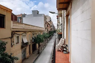 a dining room with a wooden table and chairs at Mwitu - 2 bedroom and balcony in Poblenou in Barcelona