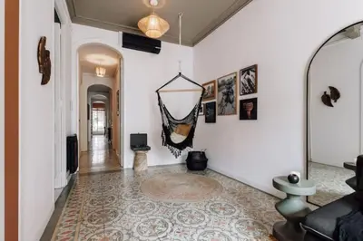 a living room with a couch and a television at Mwitu - 2 bedroom and balcony in Poblenou in Barcelona