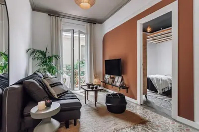 a living room with a hammock hanging from the wall at Mwitu - 2 bedroom and balcony in Poblenou in Barcelona