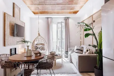 a bedroom with a wooden cabinet with baskets on top at Zongo - 2 bedroom in Eixample Dreta in Barcelona