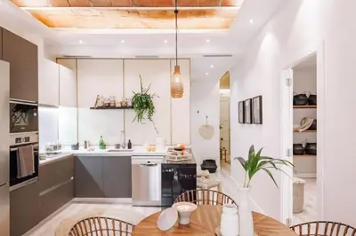 a room with a balcony with a chair and plants at Zongo - 2 bedroom in Eixample Dreta in Barcelona