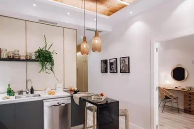 a bedroom with a bed with a large wooden headboard at Zongo - 2 bedroom in Eixample Dreta in Barcelona
