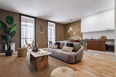 a living room with a couch and a table at Luiza - 3 bedroom in Eixample Dreta in Barcelona
