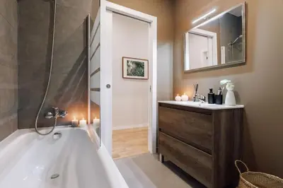 a bedroom with a large bed and a window at Luiza - 3 bedroom in Eixample Dreta in Barcelona