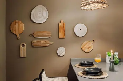 a wall with plates and utensils on a wall at Luiza - 3 bedroom in Eixample Dreta in Barcelona