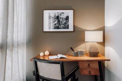 a bedroom with a large bed and a side table at Luiza - 3 bedroom in Eixample Dreta in Barcelona