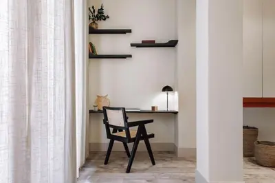 a living room with a couch and a table at Matadi - one bedroom and terrace in Eixample Esquerra in Barcelona