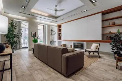 a living room with a couch and a fireplace at Matadi - one bedroom and terrace in Eixample Esquerra in Barcelona