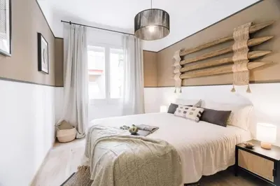 a room with a hallway with a bed and a rug at Kananga - 3 bedroom in Gracia in Barcelona