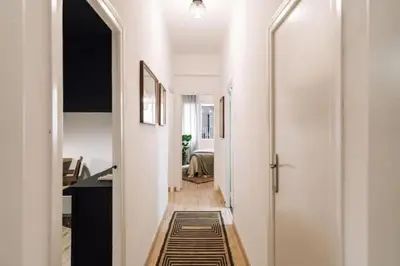 a dining room and living room with a wooden table at Kananga - 3 bedroom in Gracia in Barcelona