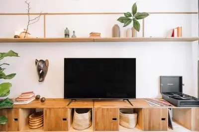 a living room with a flat screen tv on a wall at Kananga - 3 bedroom in Gracia in Barcelona