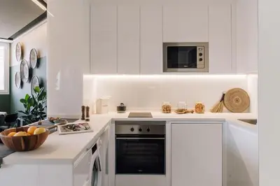 a bedroom with a large bed with two lamps at Batwa - 1 bedroom in Passeig de Gracia in Barcelona