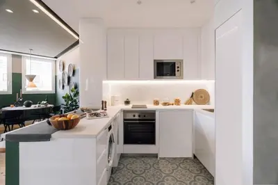 a bedroom with a large bed and two windows at Batwa - 1 bedroom in Passeig de Gracia in Barcelona