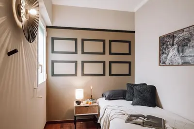 a bathroom with a sink and a room with a bed at Zamba - 2 bedroom in Passeig de Gracia in Barcelona