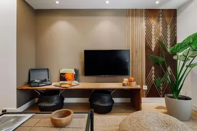 a living room with a couch and a table at Lega - 2 bedroom in Passeig de Gracia in Barcelona