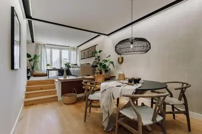 a bedroom with a large bed and a bathroom at Lega - 2 bedroom in Passeig de Gracia in Barcelona
