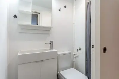 a white bathroom with a toilet and a sink at 2124 - AB Poblenou Beach Comfort in Barcelona