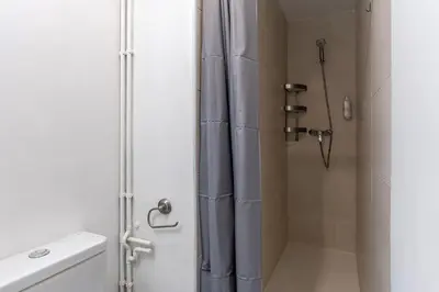 a shower with a shower curtain in a bathroom at 2124 - AB Poblenou Beach Comfort in Barcelona