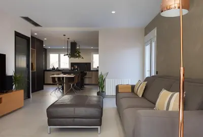 a living room with a couch and a table at Villa Beach Barcelona in Montgat