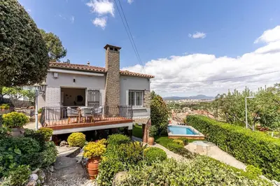 an exterior view of a house with a swimming pool at Vista Serena in Sant Cugat del Vallès