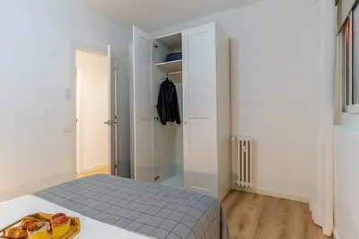 a small bedroom with a bed and a closet at 1774 - AB Saint Joseph Apartment in Barcelona