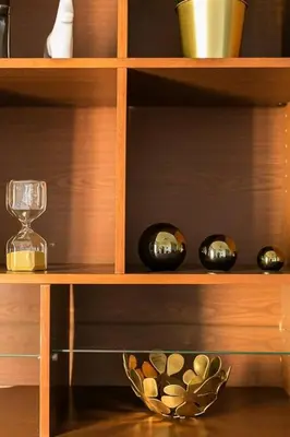 a wooden shelf with bowls and a glass at Relax In A Chic Apartment In Sants in Barcelona