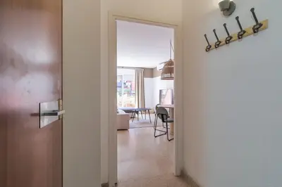 an open door to a living room with a table at Amazing Terrace In Sant Andreu in Barcelona