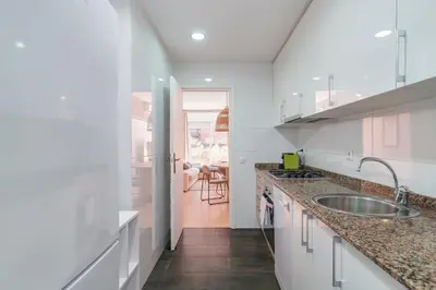 a kitchen with a sink and a counter top at Amazing Terrace In Sant Andreu in Barcelona