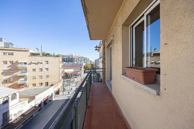 a balcony of a building with a window at Bright Attic & Amazing Terrace in Hospitalet de Llobregat
