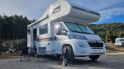 a white rv parked in a parking lot at Rent&Road in Caldes de Montbui