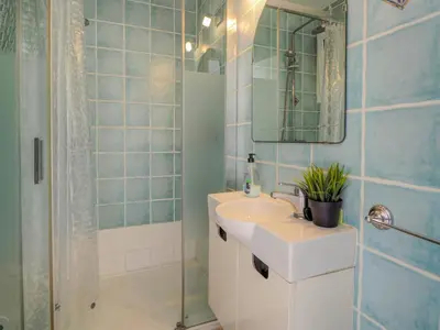 a bathroom with a sink and a shower at Arlene apartment by Hello Homes Sitges in Sitges