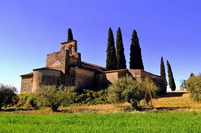 an old building with trees on a grass field at Habitación y Baño Privado, Tranquilidad y Naturaleza. in Barcelona