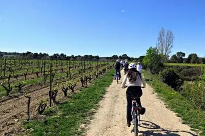 a group of people riding bikes down a dirt road at Habitación y Baño Privado, Tranquilidad y Naturaleza. in Barcelona