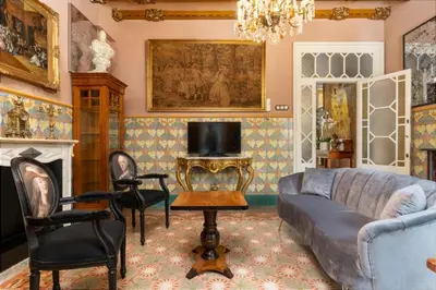 a living room with a couch and chairs at Luxury villa next to the beach in Canet de Mar