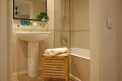 a bathroom with a sink and a shower and a sink at Chic & Basic Lemon Boutique Hotel in Barcelona