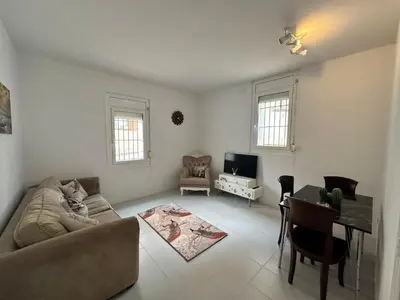 a living room with a couch and a table at Vista Alegre Rest House for 7 Persons in Vallromanas