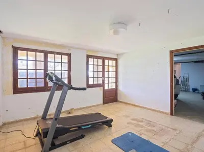a room with a gym with a treadmill in it at Villa Marítima in Pineda de Mar in Pineda de Mar
