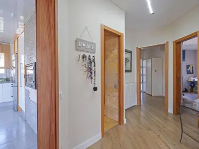 a hallway with a door with a love sign on the wall at Villa Marítima in Pineda de Mar in Pineda de Mar