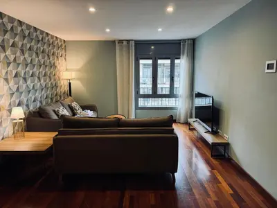 a living room with a couch and a table at Sweet BCN Sagrada Familia in Barcelona