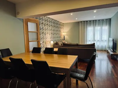 a room with a table and chairs and a couch at Sweet BCN Sagrada Familia in Barcelona